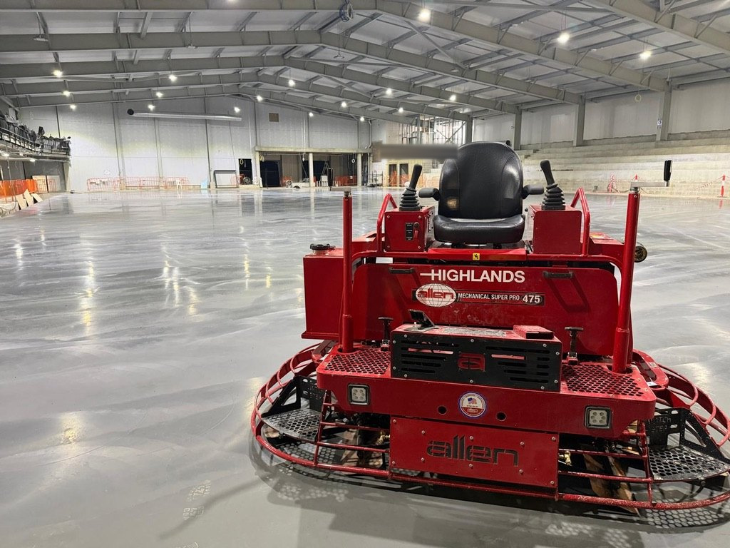 Highlands Allen MSP475 ride-on trowel on the finished competition ice rink slab