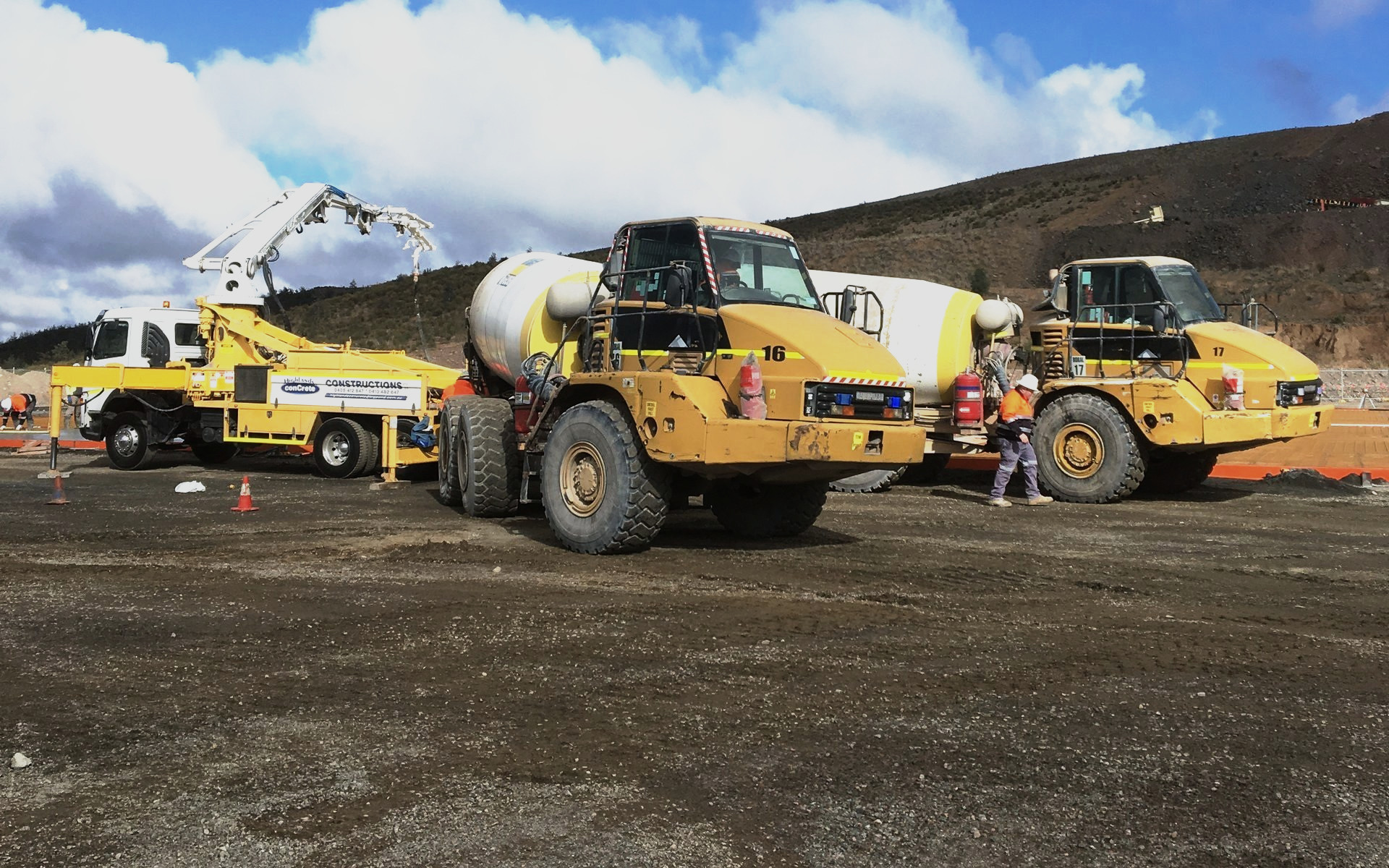 Boom pump and off-road agitators on a remote site pour